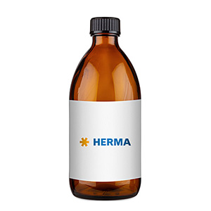 Bouteille en verre brun avec une étiquette blanche sur laquelle est inscrit "HERMA" en lettres bleues.