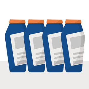 Quatre bouteilles bleues avec des bouchons orange, qui ont une étiquette vide sur le devant.