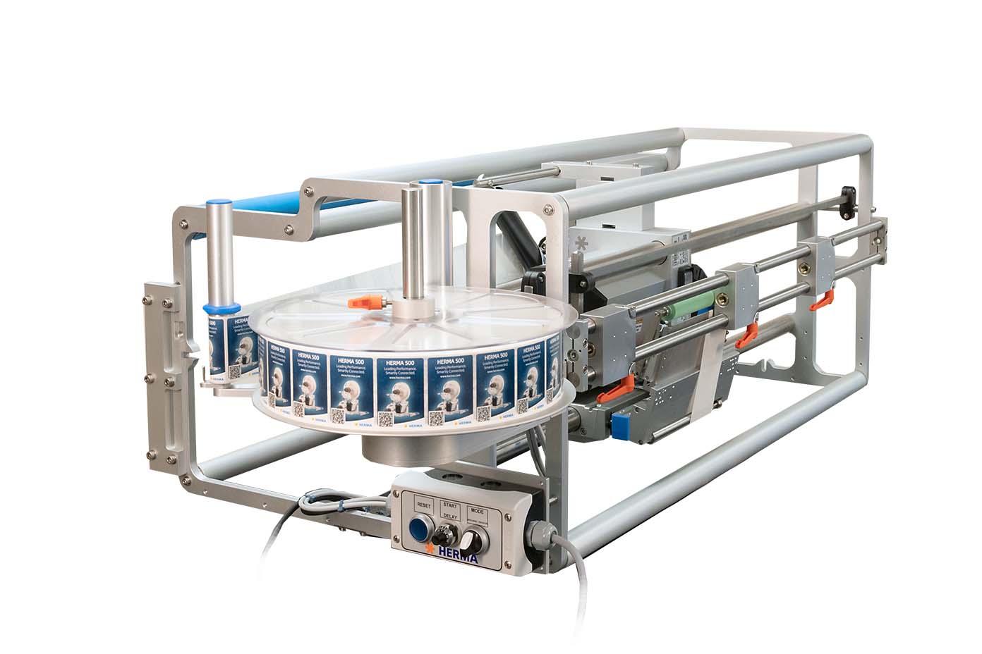 Texte : "Machine d'étiquetage avec un disque rotatif qui applique des étiquettes sur les produits. Construction robuste avec des éléments de commande.