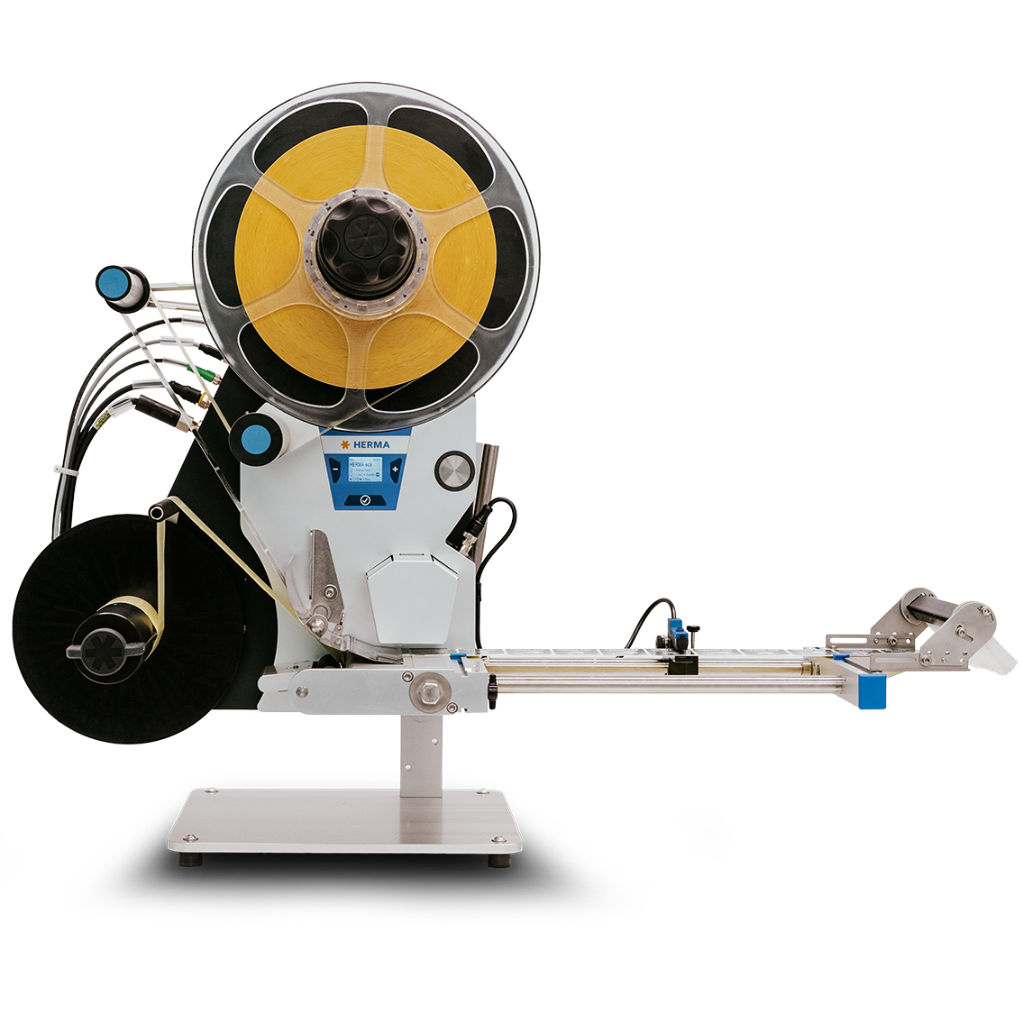 Une machine automatisée pour l'application d'étiquettes, équipée d'une grande bobine et d'un mécanisme d'alimentation précis.