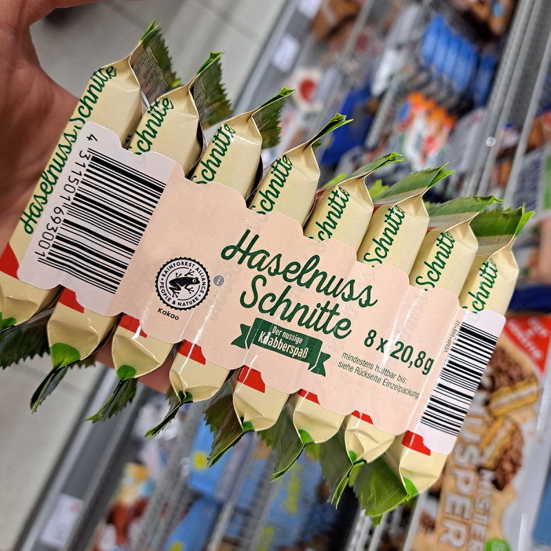 Solutions alimentaires : Étiquette à bande perforée sur l'emballage des barres de noix.