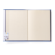 Ein geöffnetes Notizbuch mit leeren Seiten und einem Aufkleber auf der linken Seite.