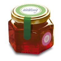 Étiquette de couvercle sur un pot de miel