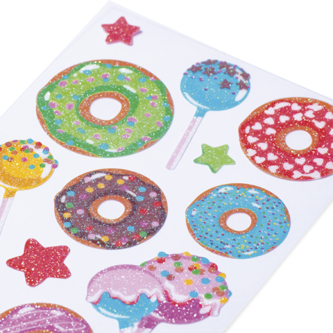 Bunte Aufkleber mit Donuts, Lollis und Sternen in verschiedenen Farben und Mustern.